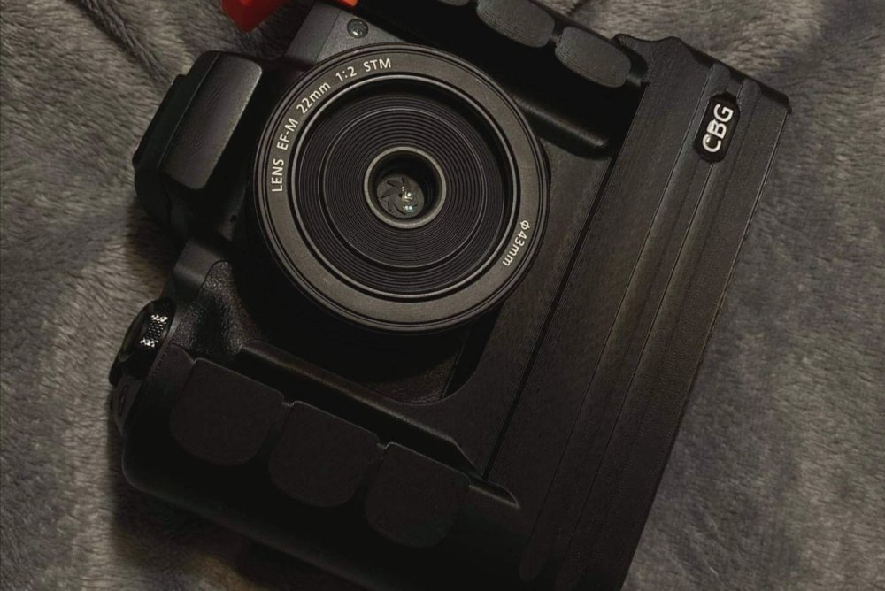 Our Extended Battery Grip for Canon EOS M50 with orange cold shoe